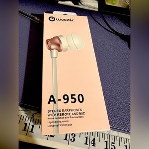 NIB WIRED headphones pink/white in color, volume control